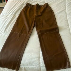 We are 4 Free vegan leather rich brown pants. Hardly worn. Great condition!